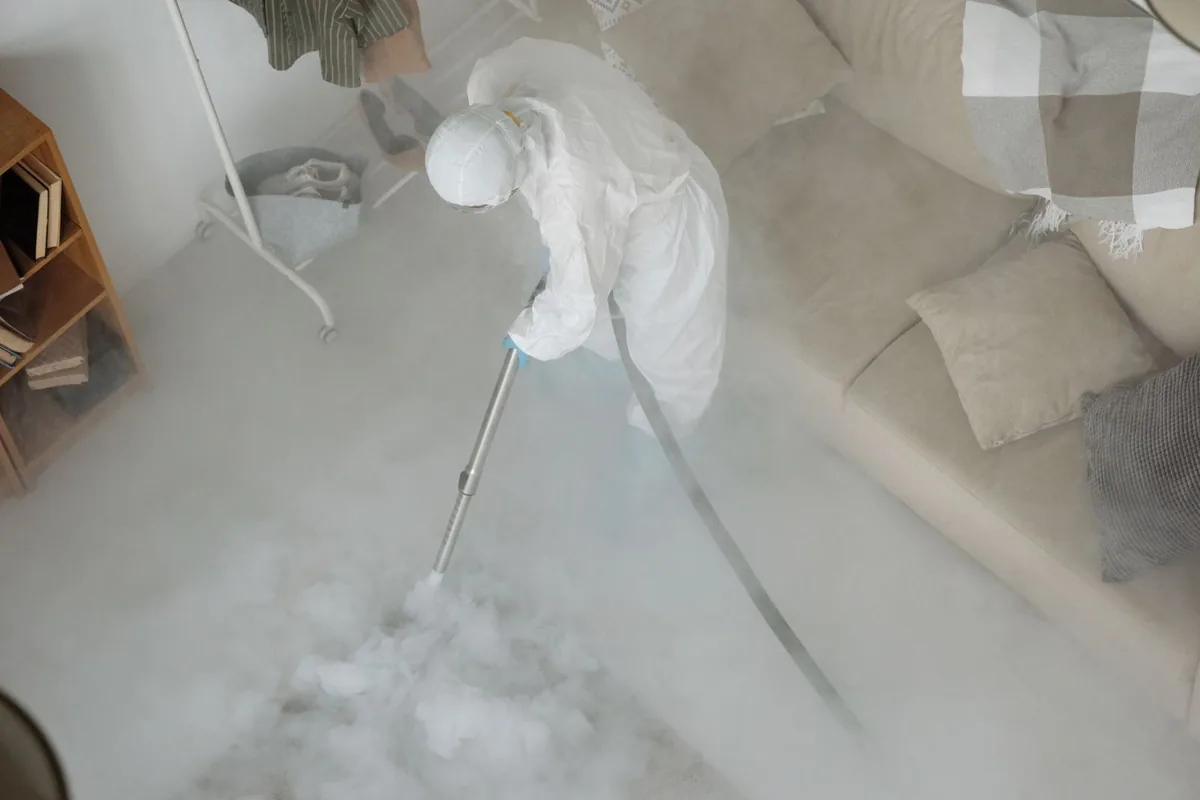 Biohazard cleanup technician in protective equipment, Upper Pohatcong, NJ